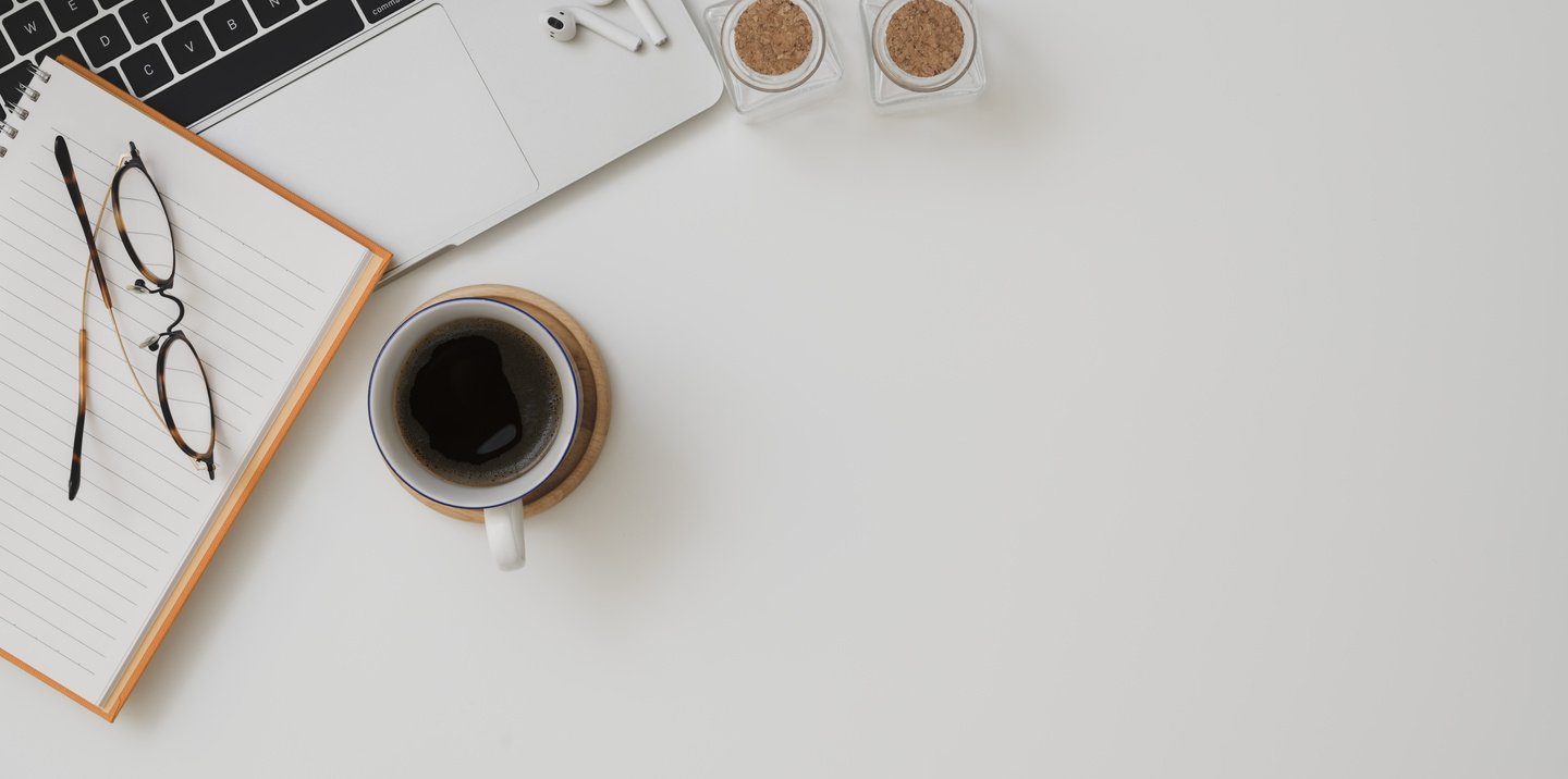 Photo Of Ceramic Mug Near Notebook